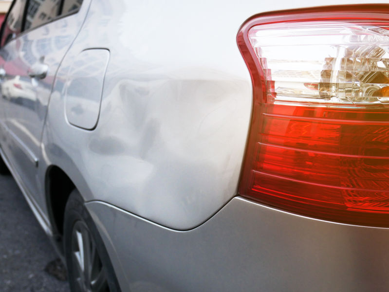 Car dent on side of car