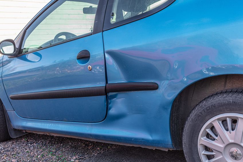 car dent in the side of the car
